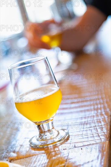 Abstract of small glass of micro brew beers on bar