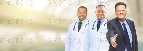 Caucasian businessman and african american male doctors