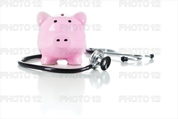 Piggy bank and stethoscope isolated on a white background