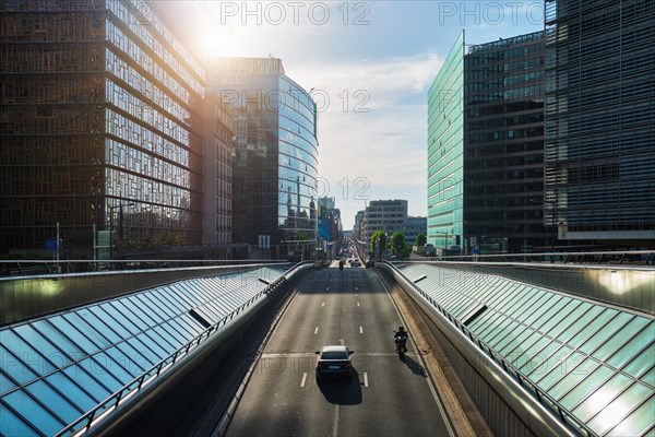 Street traffic in Brussels near European Commission building on sunset. Rue de la Loi