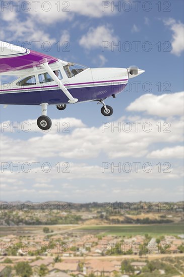 The cessna 172 single propeller airplane flying in the sky