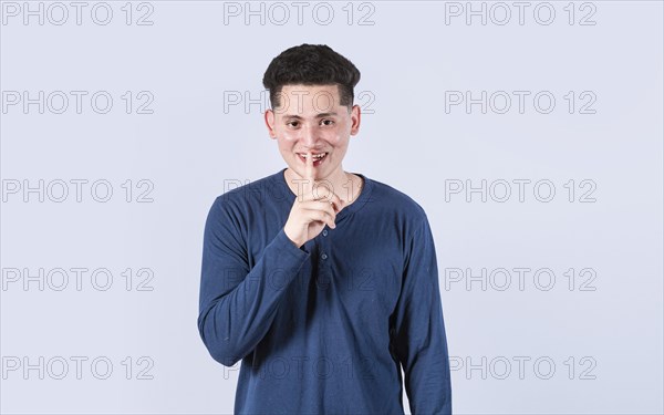 Man gesturing keep quiet