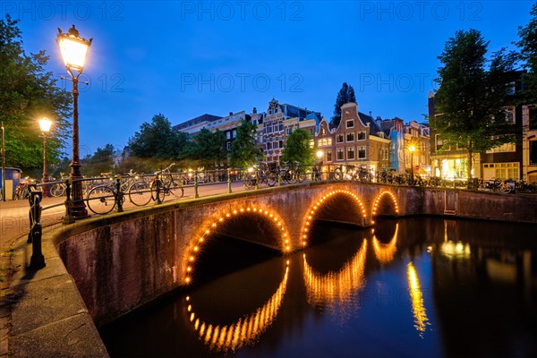 Night view of Amterdam cityscape with canal