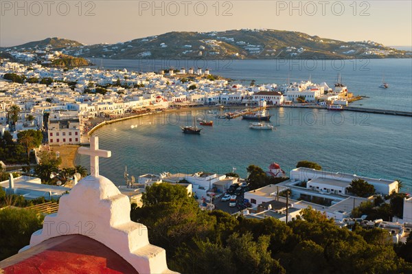 View of Mykonos town Greek tourist holiday vacation destination with famous windmills