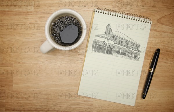 Pad of paper with house drawing