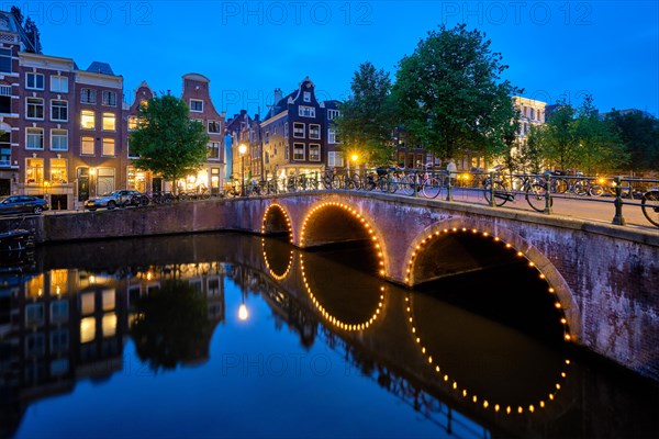 Night view of Amterdam cityscape with canal