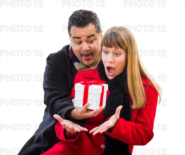 mixed-race couple exchanging christmas gift isolated on white