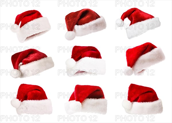 Set of Santa's red hats isolated on white