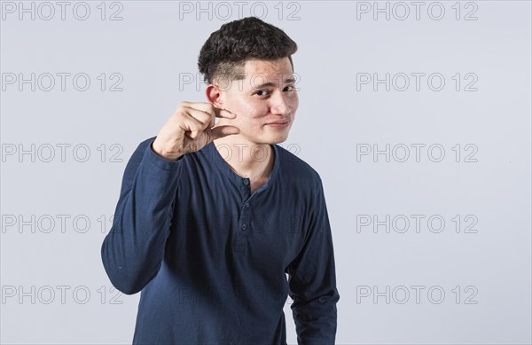 Man showing a small amount with his fingers