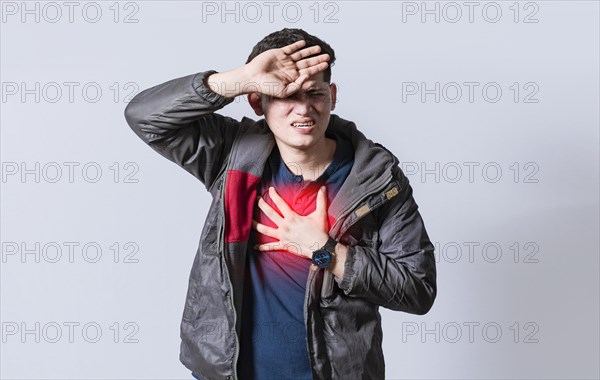 Man with heart pain on isolated background