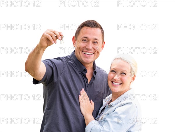 Young adult couple holding new house keys isolated on A white background