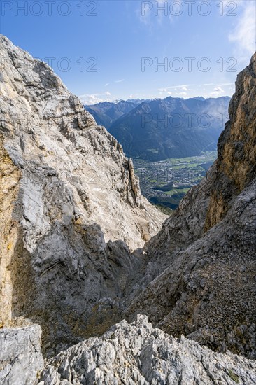 Scharte with view into the Inn valley with the village of Telfs