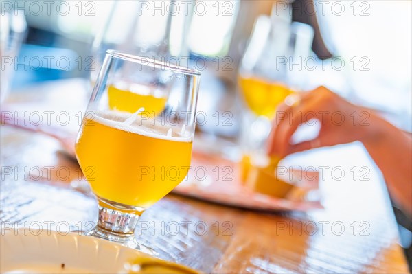Abstract of small glass of micro brew beers on bar