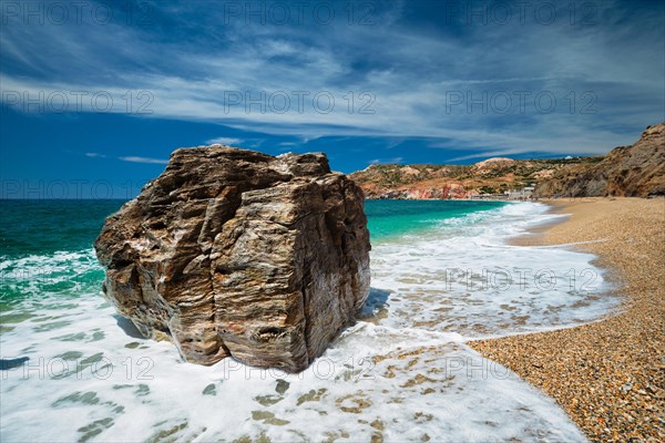 Rocks on Paleochori beach and waves of Aegean sea