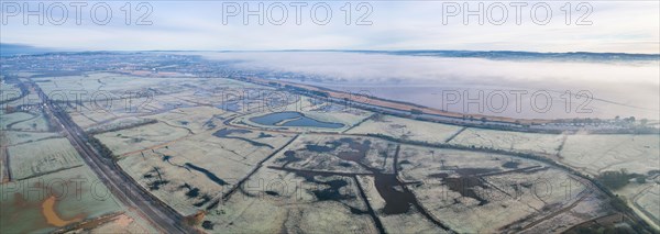 RSPB Exminster and Powderham Marshes and River Exe from a drone at sunrise