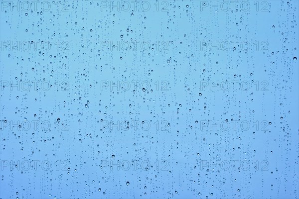 Rain water drops droplets on window glass texture background