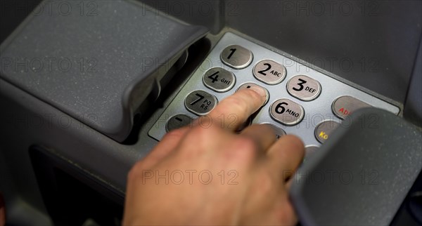 Hand at an ATM