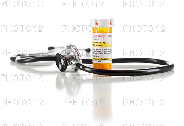 One non-proprietary medicine prescription bottle with stethoscope isolated on a white background