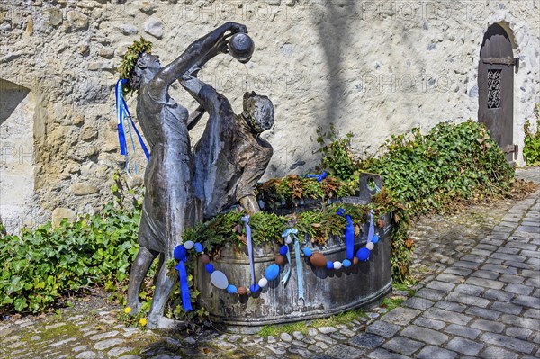 Head-washing fountain at the city wall by Gisela Steimle with Easter decoration