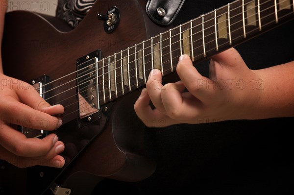 Musician plays his gibson les paul studio electric guitar