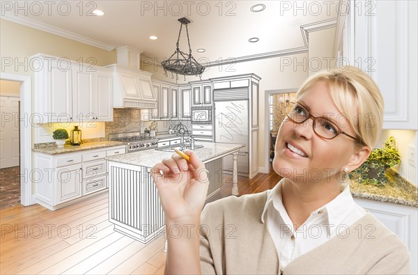 Creative woman with pencil over custom kitchen design drawing and photo combination