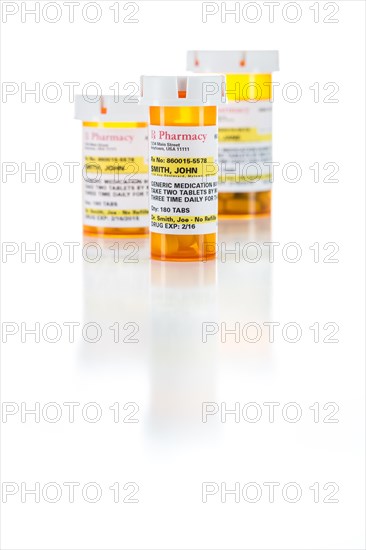 Three non-proprietary medicine prescription bottle isolated on a white background