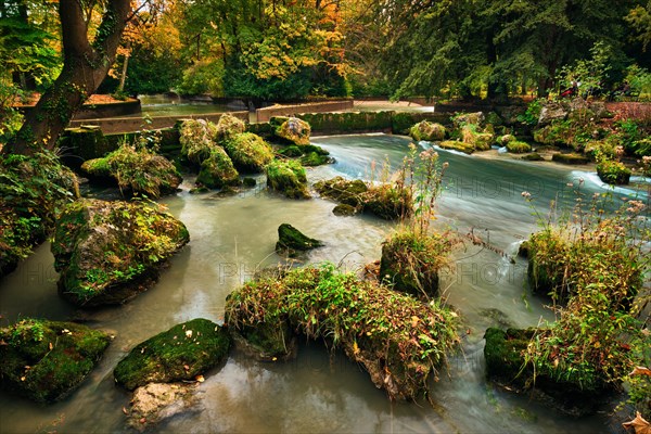 Munich English garden Englischer garten park and Eisbach river with artificial waterfall