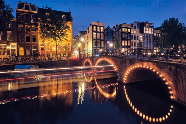 Night view of Amterdam cityscape with canal