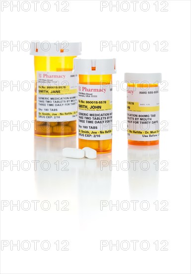 Non-Proprietary medicine prescription bottles and pills isolated on a white background