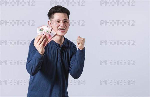 Excited man with money in his hand