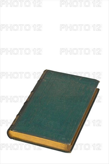 Old book with green cover isolated on white background