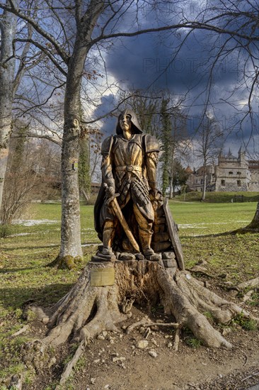 Wooden figure of Knight Lichtenstein in front of Lichtenstein Castle