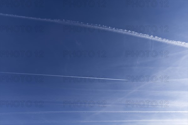 Vapor trails in blue sky