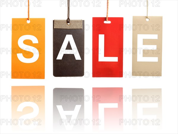 Sale written on paper tags isolated on white background