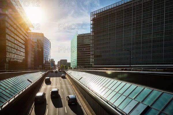 Street traffic in Brussels near European Commission building on sunset Rue de la Loi