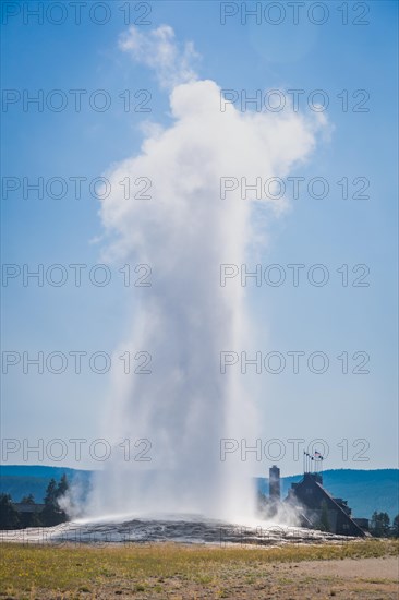 Old faithful geyser erupting at yellowstone national park