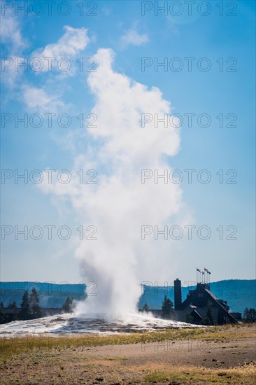 Old faithful geyser erupting at yellowstone national park