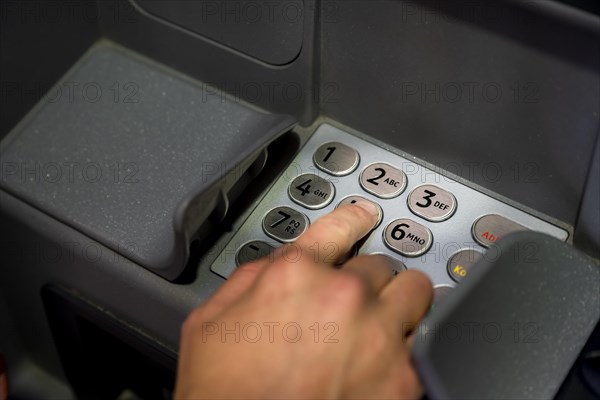 Hand at an ATM