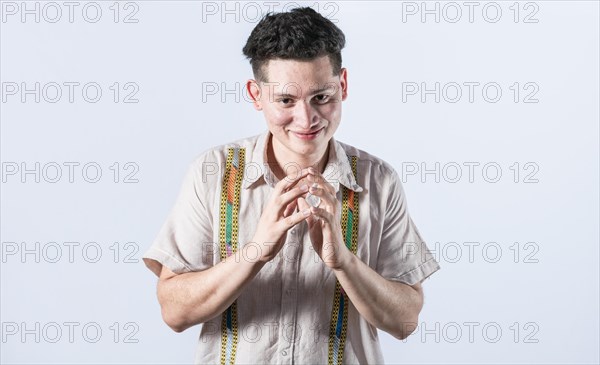 Cunning man rubbing his hands on isolated background