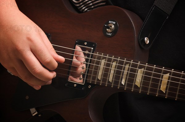 Musician plays his gibson les paul studio electric guitar