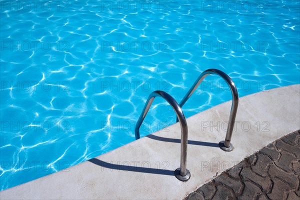 Metal ladder to swimming pool