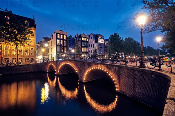 Night view of Amterdam cityscape with canal