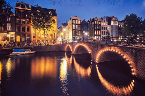 Night view of Amterdam cityscape with canal