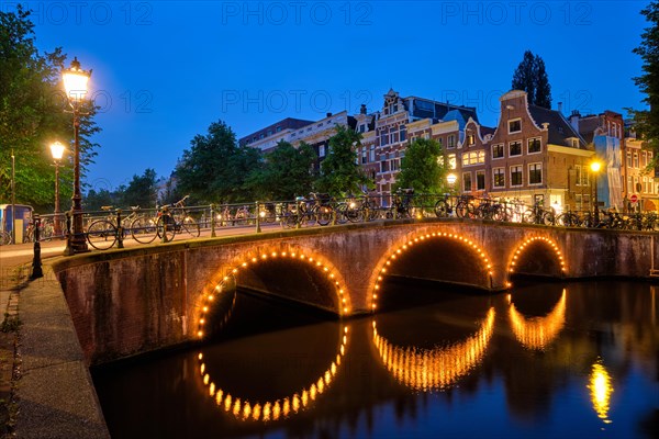 Night view of Amterdam cityscape with canal