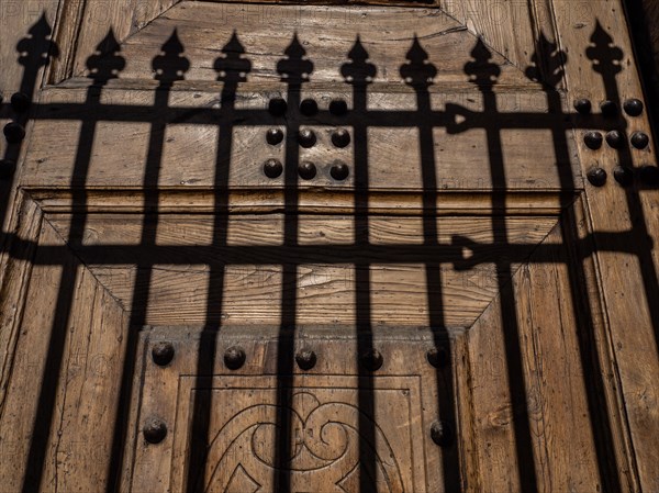 Shadow from a fence at the church gate