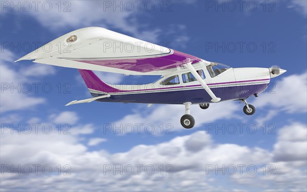 The cessna 172 single propeller airplane flying in the sky