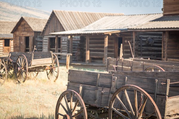 Abstract of vintage antique wood wagon and log cabins