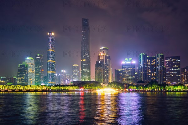 Guangzhou cityscape skyline over the Pearl River illuminated in the evening. Guangzhou