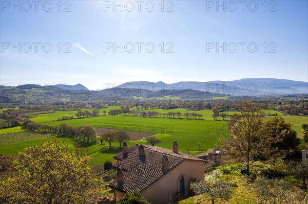 View of the green Umbrian countryside from the old town of Spello