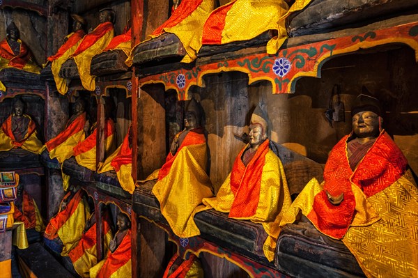 Buddhist Lama statues in library of Thiksey Gompa